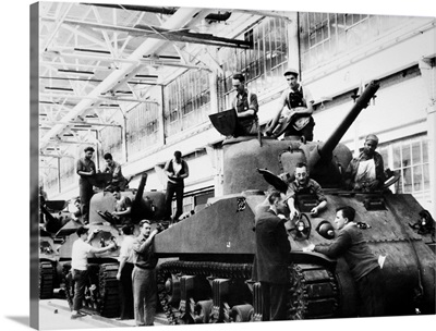 Mechanics working on M-4 tanks at a Ford Motor Company munitions plant, 1942