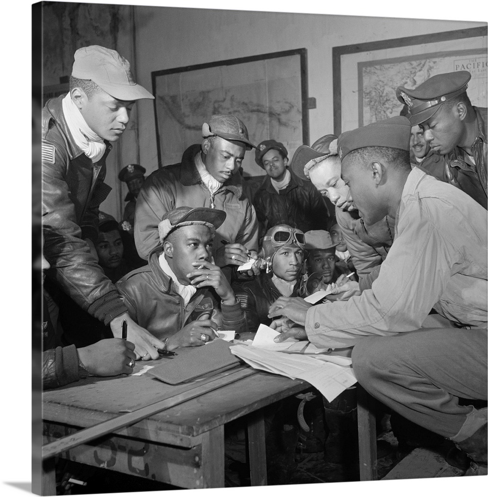 Members of the Tuskegee Airmen in a meeting at Ramitelli, Italy. Front row seated, left to right: unidentified; Jimmie Whe...