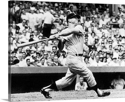 Mickey Mantle of the New York Yankees, hitting his 49th home run of the season