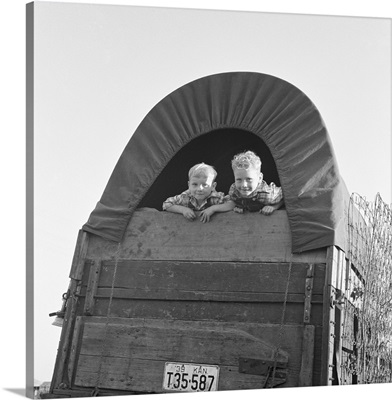 Migrant Family, 1939, in a covered wagon from Kansas