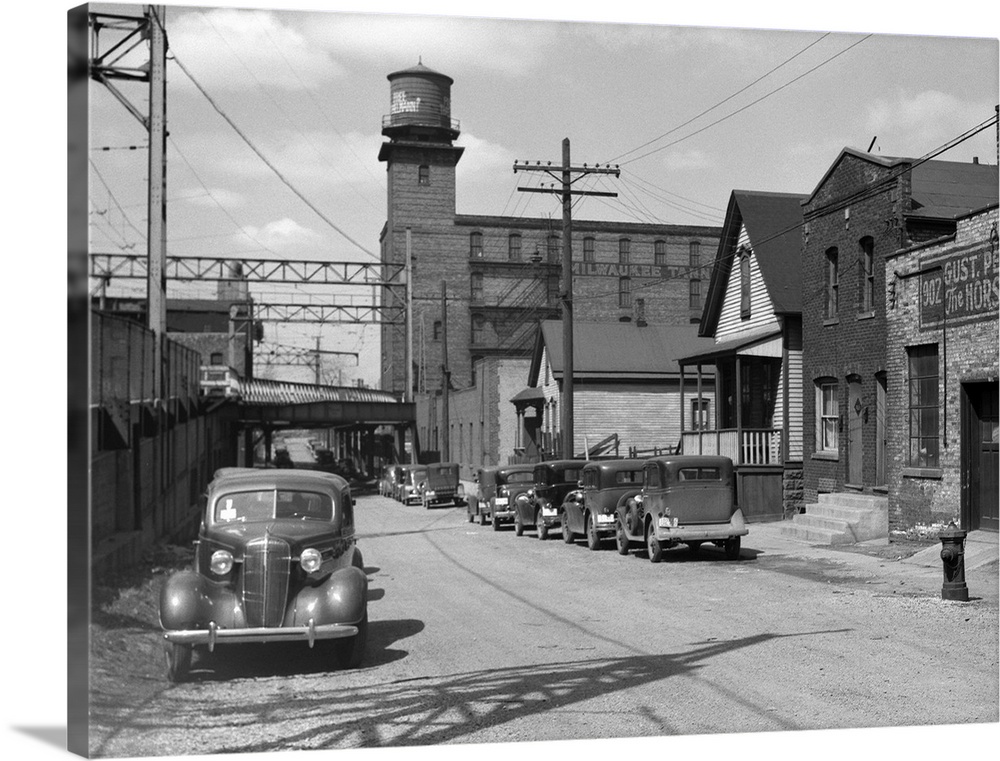 Working class houses on Detroit and Van Buren Streets, near the electric railroad, Milwaukee, Wisconsin. Photograph by Car...