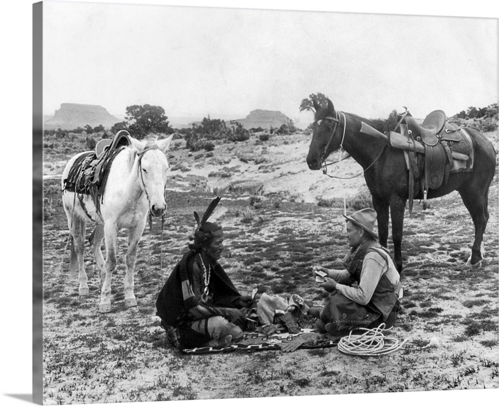 Playing Cards, C1915. A Cowboy And A Native American Man Seated On A Blanket And Playing Cards On the Great Plains. Photog...