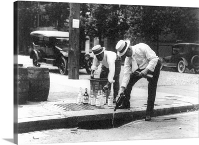 Prohibition, 1920's, Men pouring bootleg whiskey into a sewer