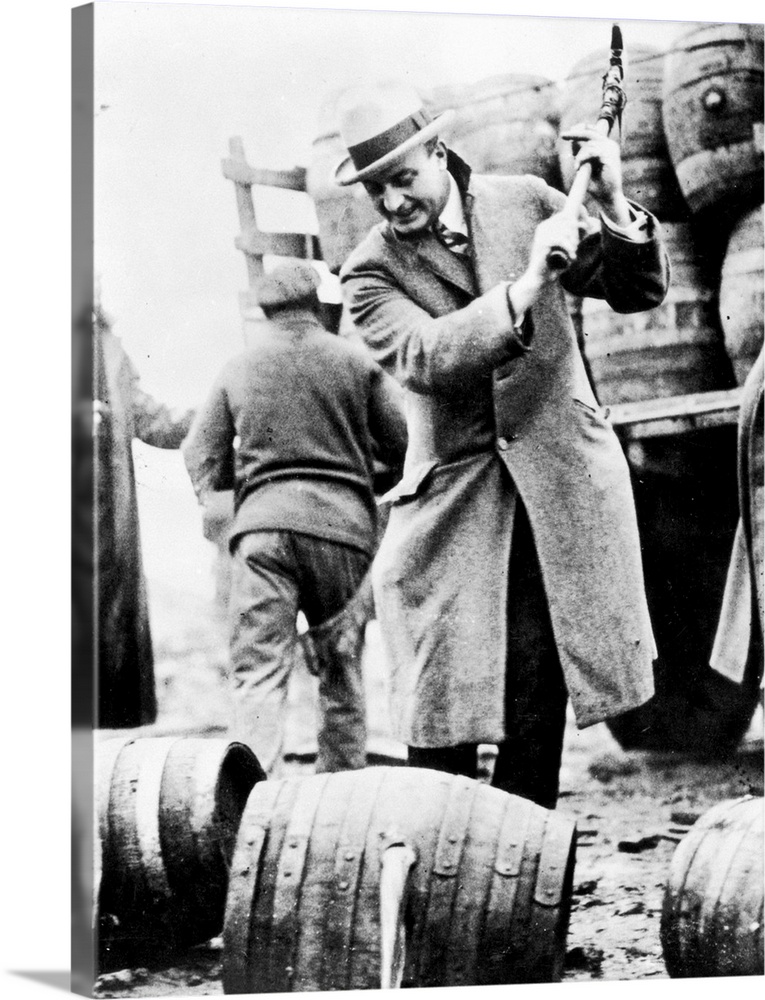 Philadelphia public safety director Butler destryoing contraband kegs of bootleg beer, the contents of which had been pour...