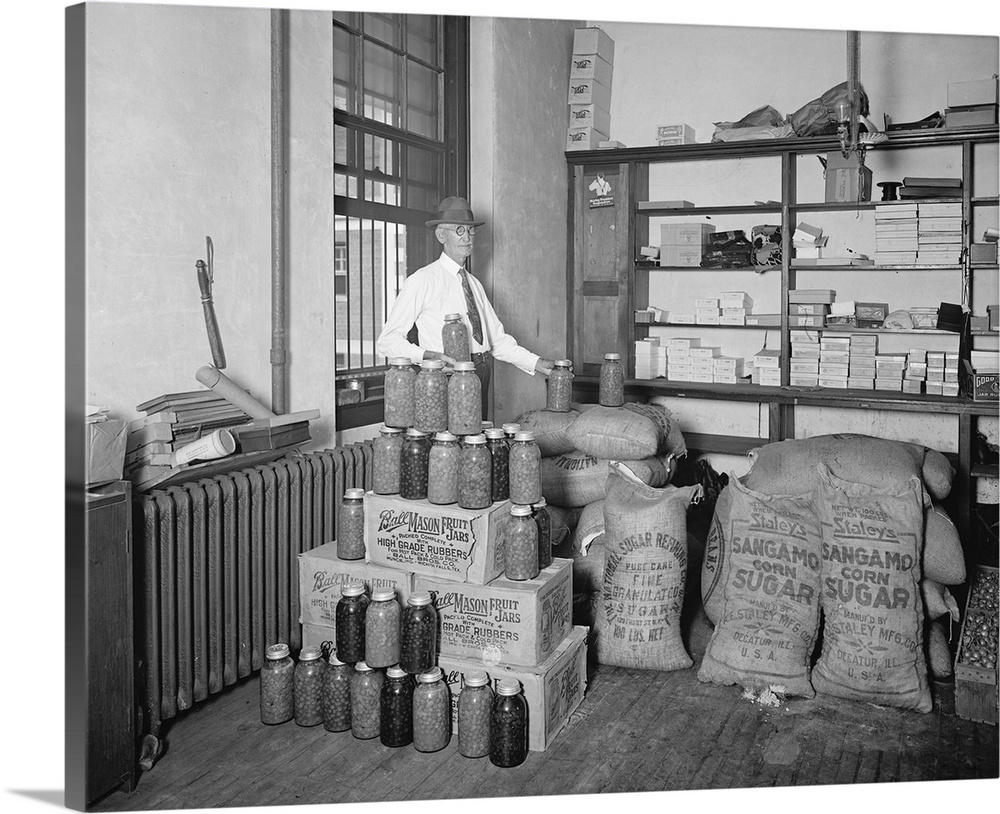 A man displaying the utilization of confiscated bootlegger paraphernalia during Prohibition in American, 1920s.
