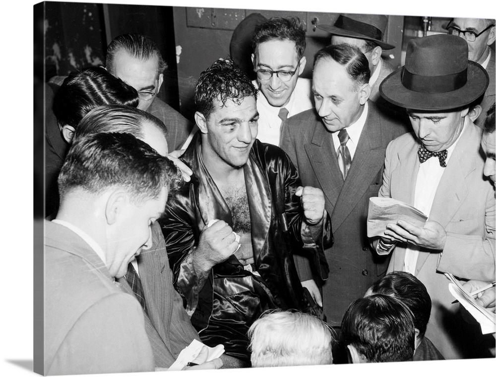 American boxer. Marciano talking with reporters after his victory against Joe Louis at Madison Square Garden in New York C...