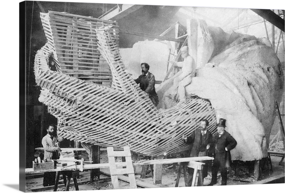 The Statue of Liberty under construction in Paris, c1883. Its sculptor, Frederic Bartholdi, stands second from right.