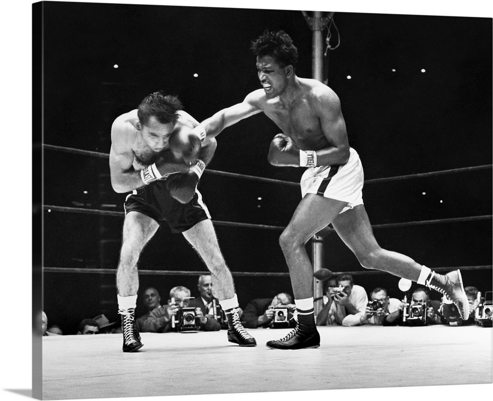 (1921-1989). N? Walker Smith, Jr. Robinson (right) during the seventh round of a fight against Carmen Basilio, 1957.