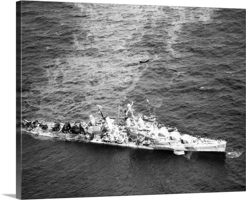 Aerial view of the USS Reno after being torpedoed, photographed alongside the USS Zuni, 5 November 1944.