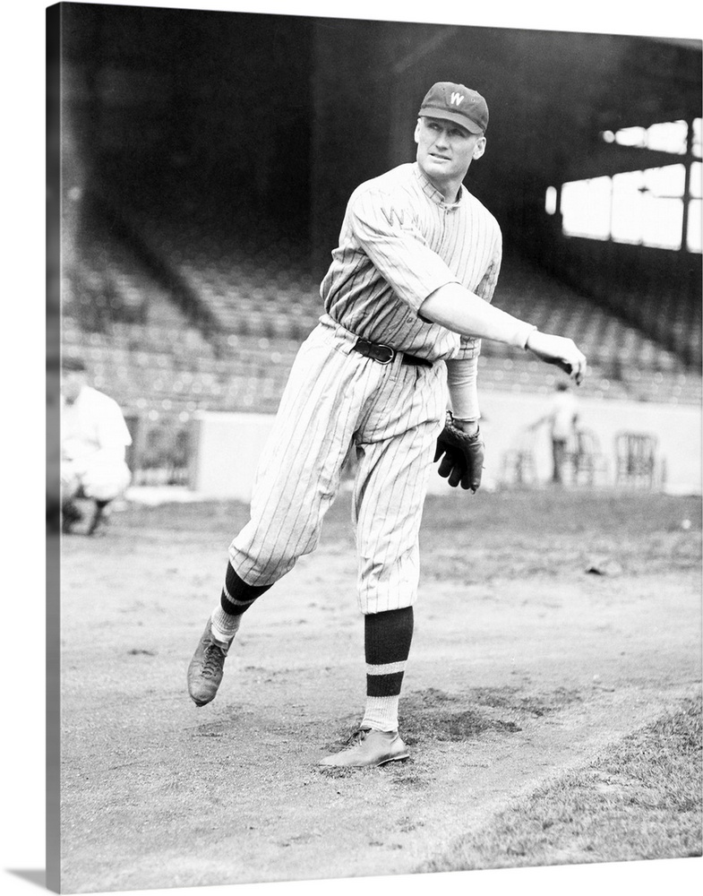 (1887-1946). American baseball player. Pitching in 1924.