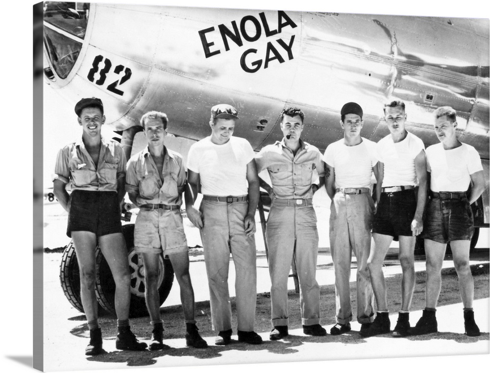 Colonel Paul W. Tibbets (center) and ground crew of the B-29 'Enola Gay' which dropped the first atomic bomb on Hiroshima,...