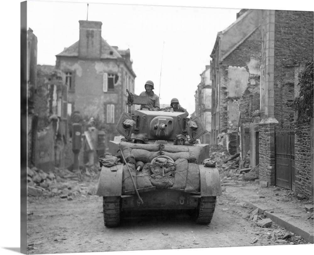 An American tank moving through liberated Saint-Lo, Normandy, France, July 20, 1944.