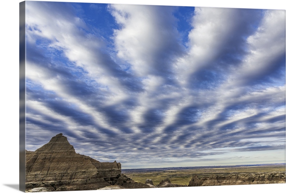 Interesting cloud pattern in the sky over Badlands National Park, South Dakota.