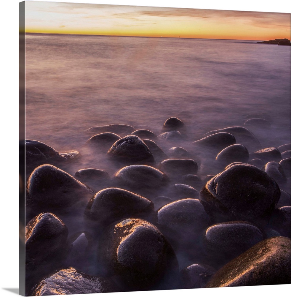 Smooth round rocks on the beach in Acadia National Park, Maine.