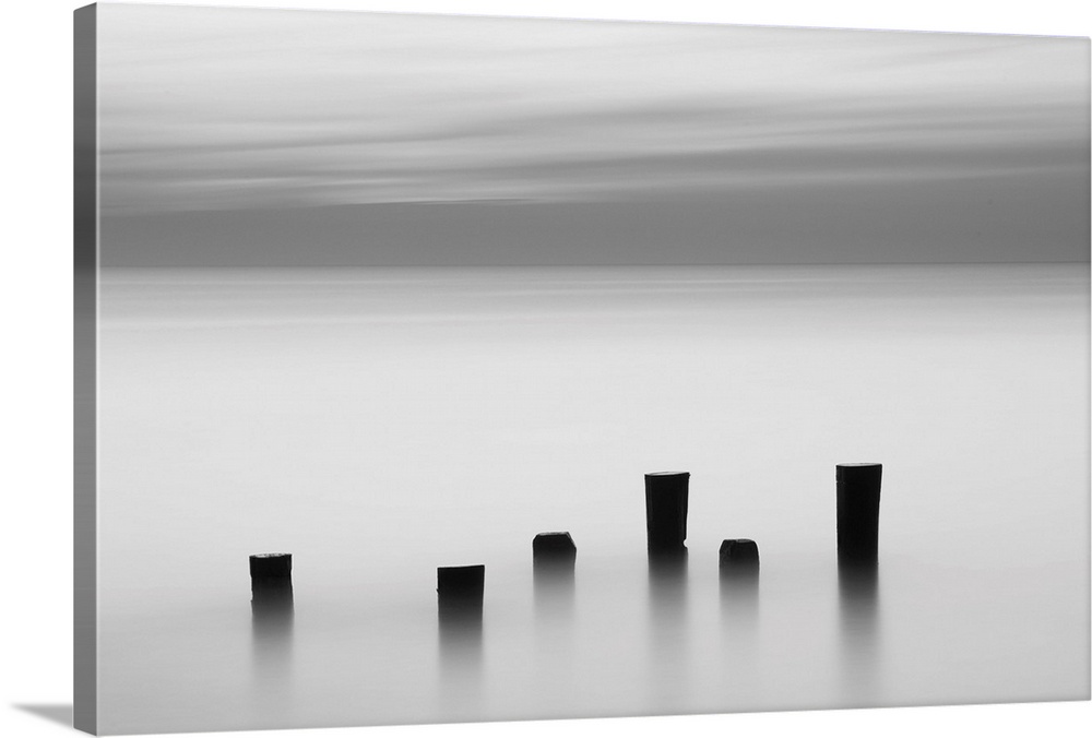 Old wooden posts in the ocean off the coast of Cape May, New Jersey.