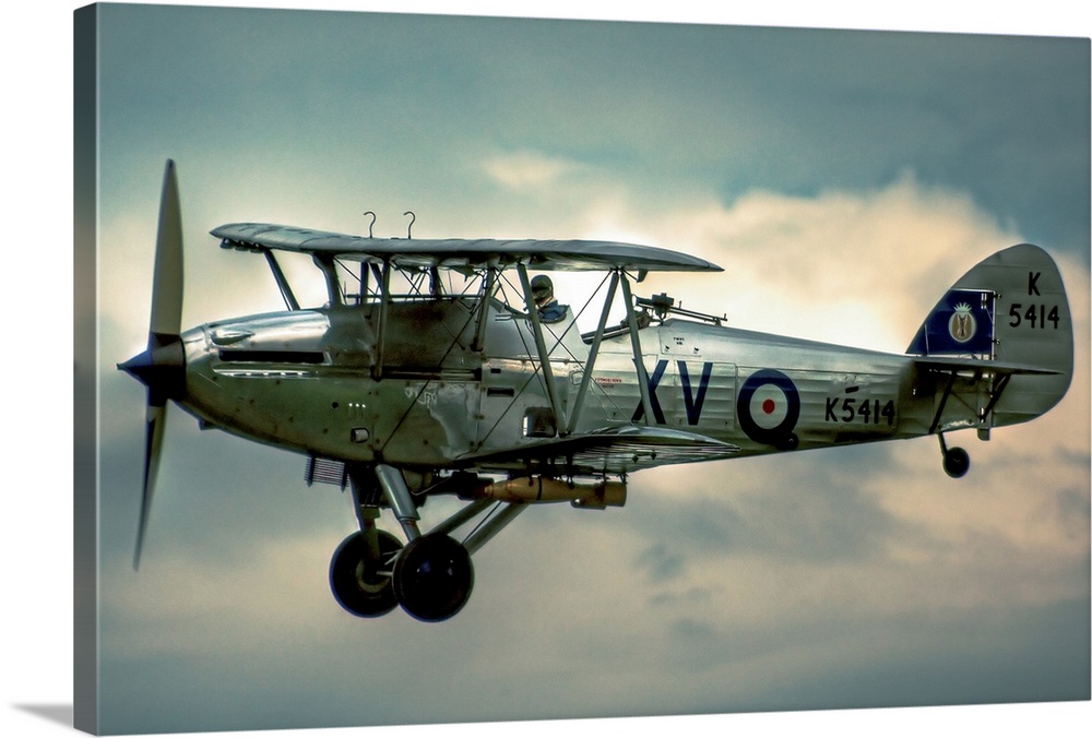 A 1935 Hawker Hind flying on a cloudy day