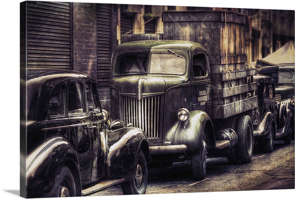 A 1942-ford-hauler parked in city side street.