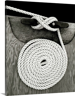 A coiled rope on a dock