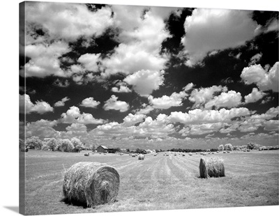 A hayfield with summer clouds