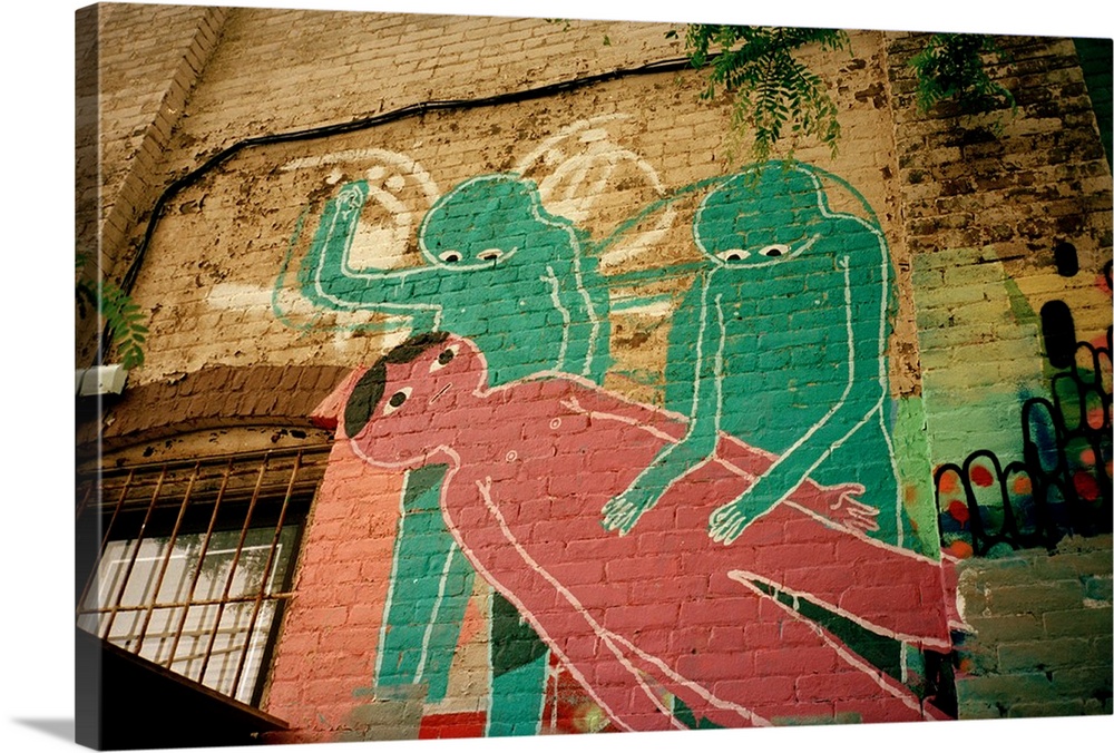 mural painting of two aliens performing an experiment on a man