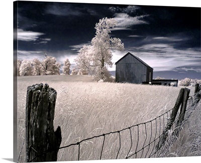 An old fence with a timber barn