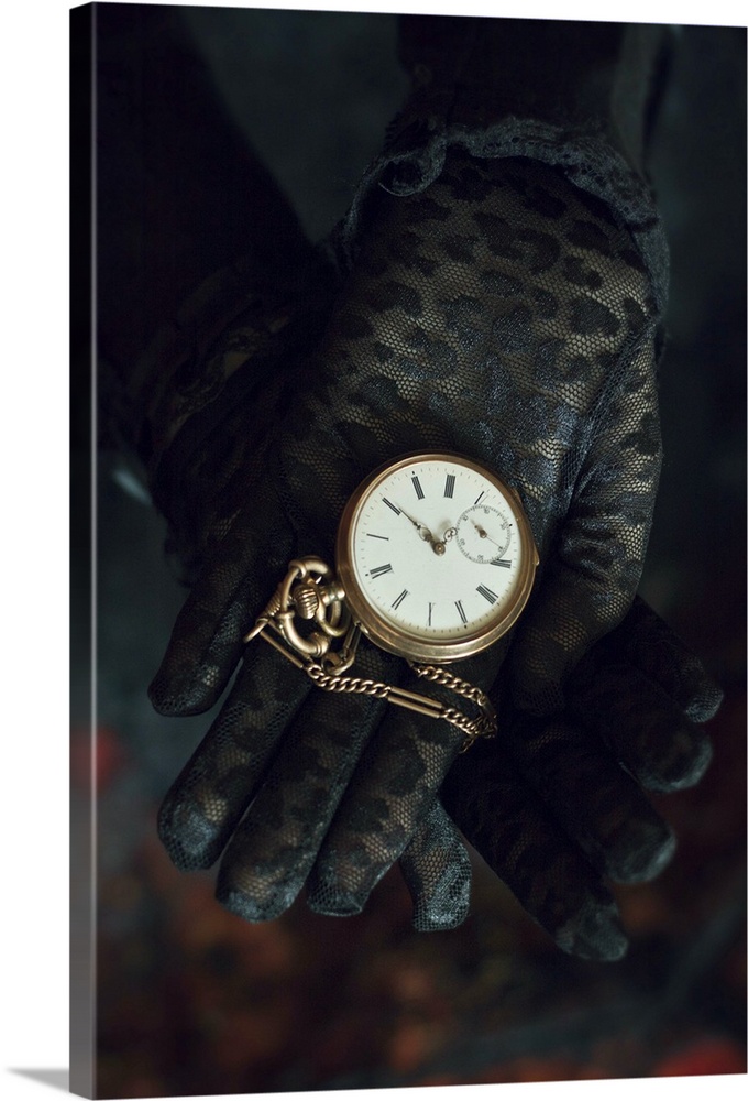 Two hands in black lace gloves holding necklace with open golden pocket watch
