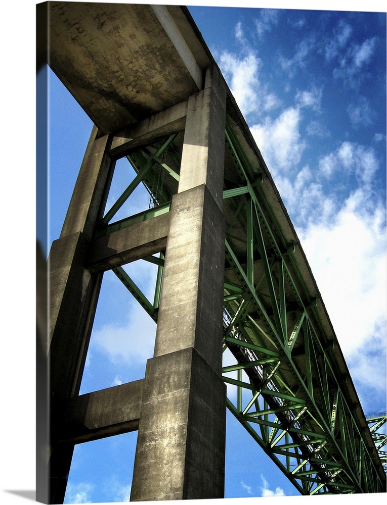 A high rail bridge against a blue sky