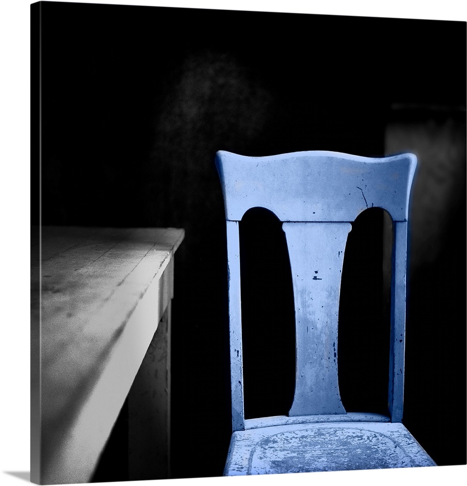 A blue chair beside a table