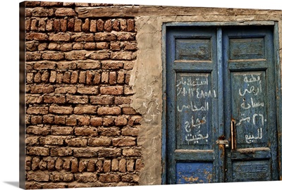 Blue door with Arabic writing, Luxor town, Egypt