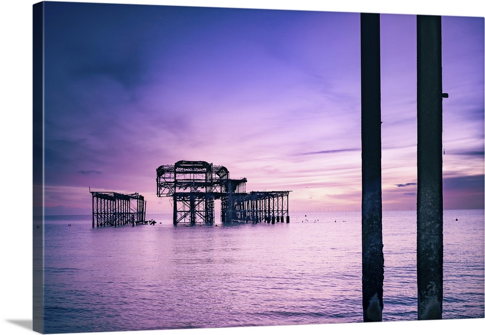 Brighton is a seaside town in the south of England, UK. Dusk on the beach. The West Pier is a pier in Brighton, England. I...