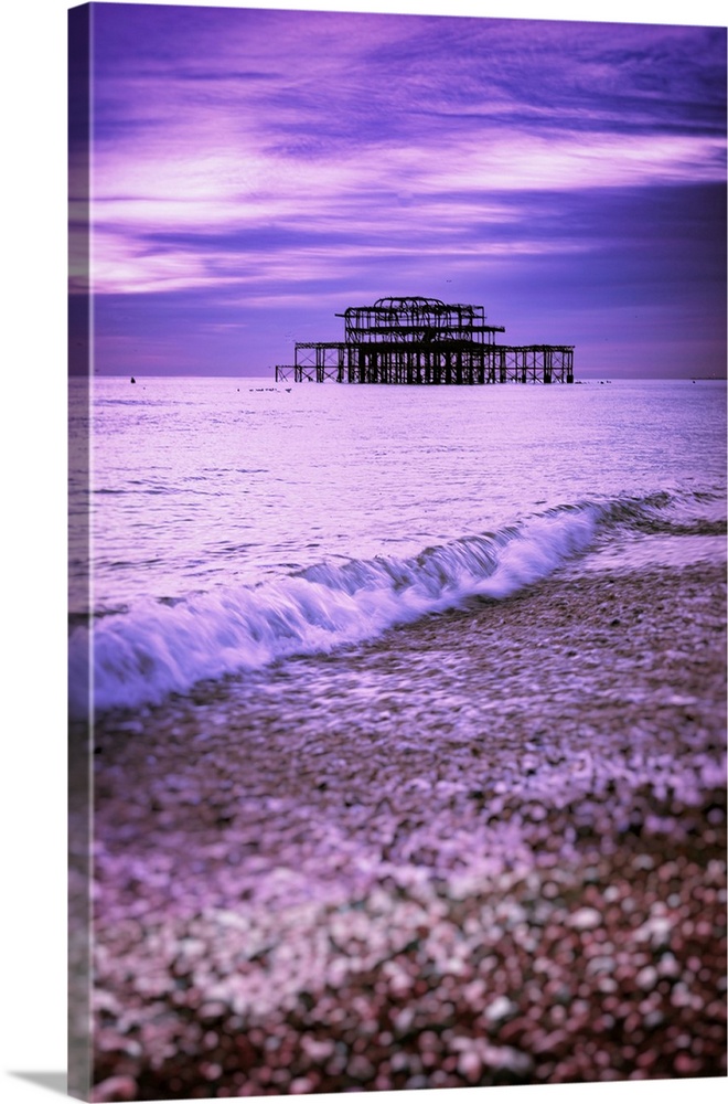 Brighton is a seaside town in the south of England, UK. Dusk on the beach. The West Pier is a pier in Brighton, England. I...