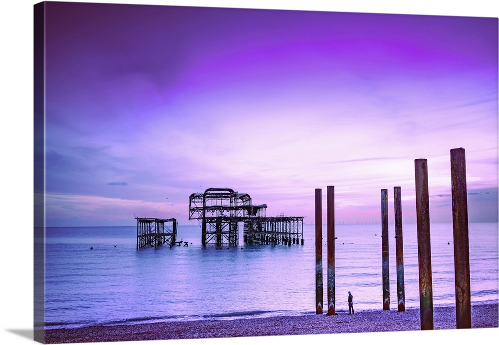 Brighton is a seaside town in the south of England, UK. Dusk on the beach. The West Pier is a pier in Brighton, England. I...