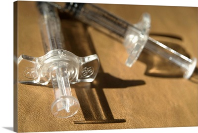 Closeup of a pair of syringes