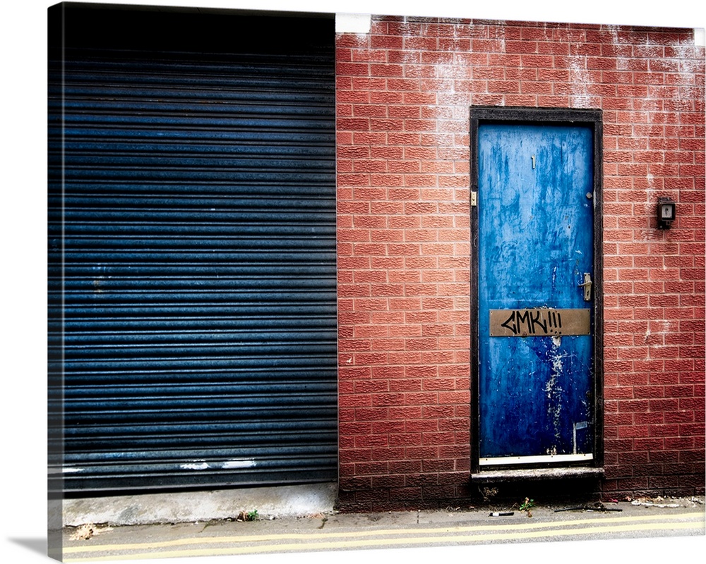 Derelict door with graffiti