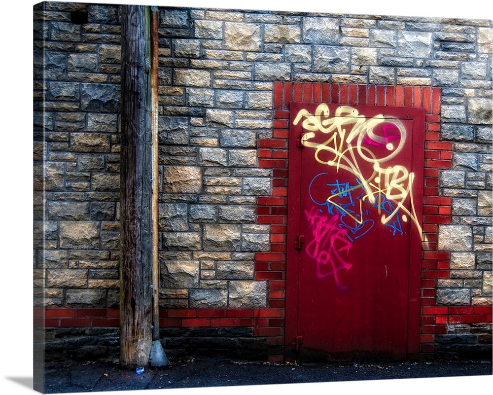 Derelict door with graffiti and lampost