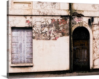 Derelict front of buidling with door and window