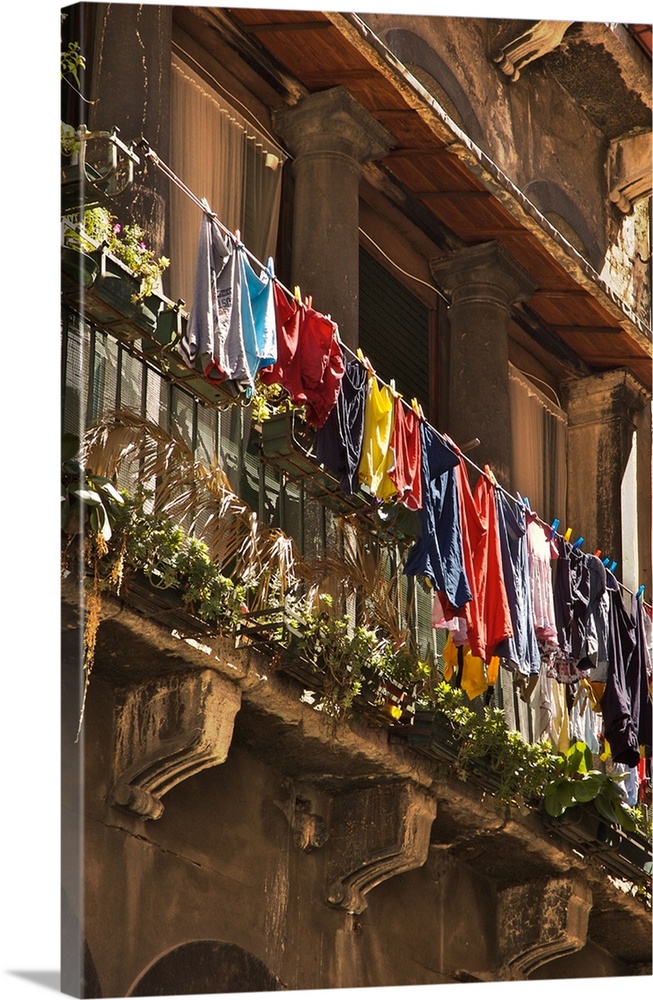 Italian building with balcony and hanging washing in Venice