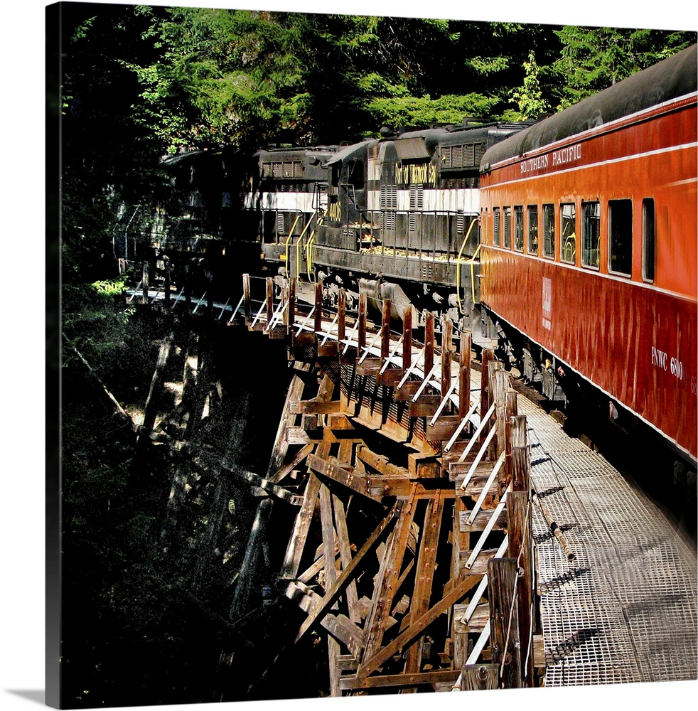 A train crossing a wooden bridge
