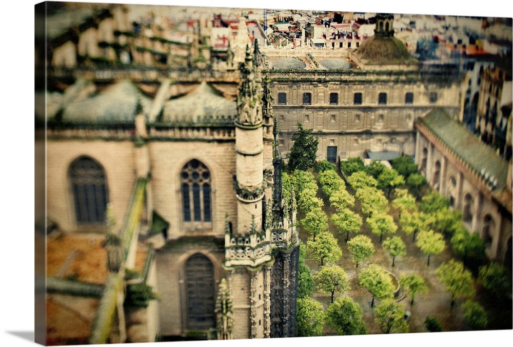 View of the Cathedral and Orange Tree Yard from the top of the Giralda tower, Seville, Spain. Tilted lens used for a shall...