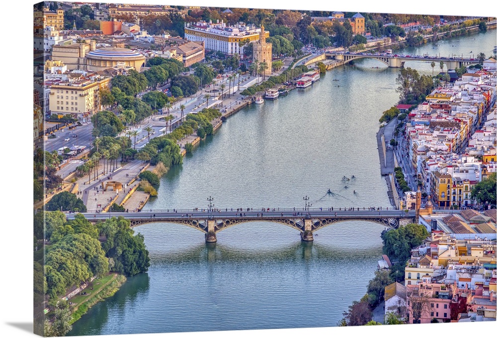 Aerial view of Triana (foreground) and San Telmo (background) bridges over the Guadalquivir river, Seville, Spain.