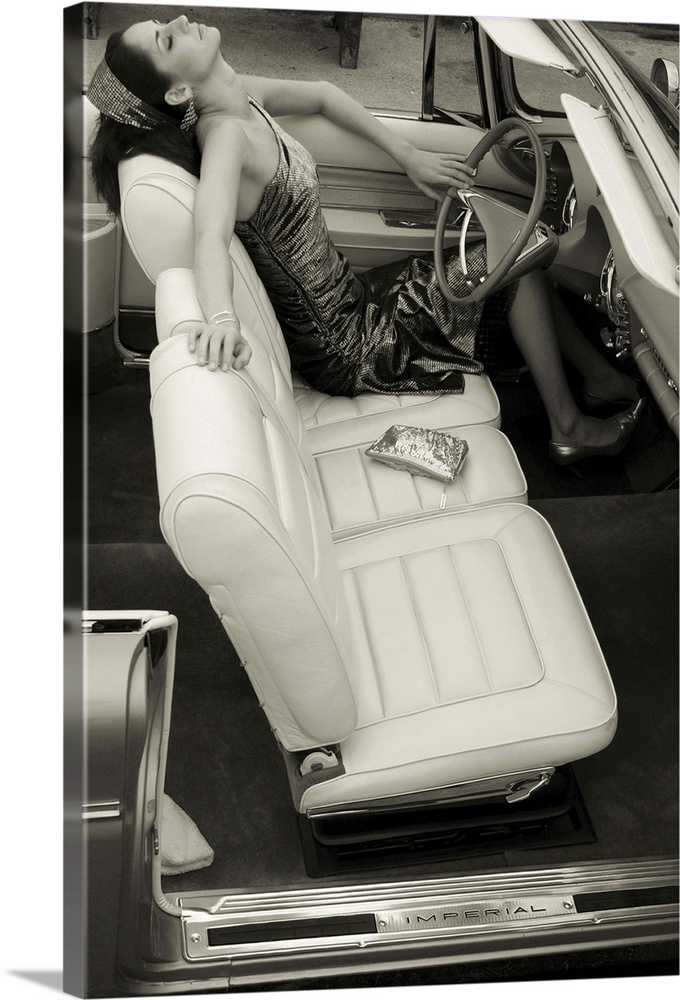 A young model sitting in the driving seat