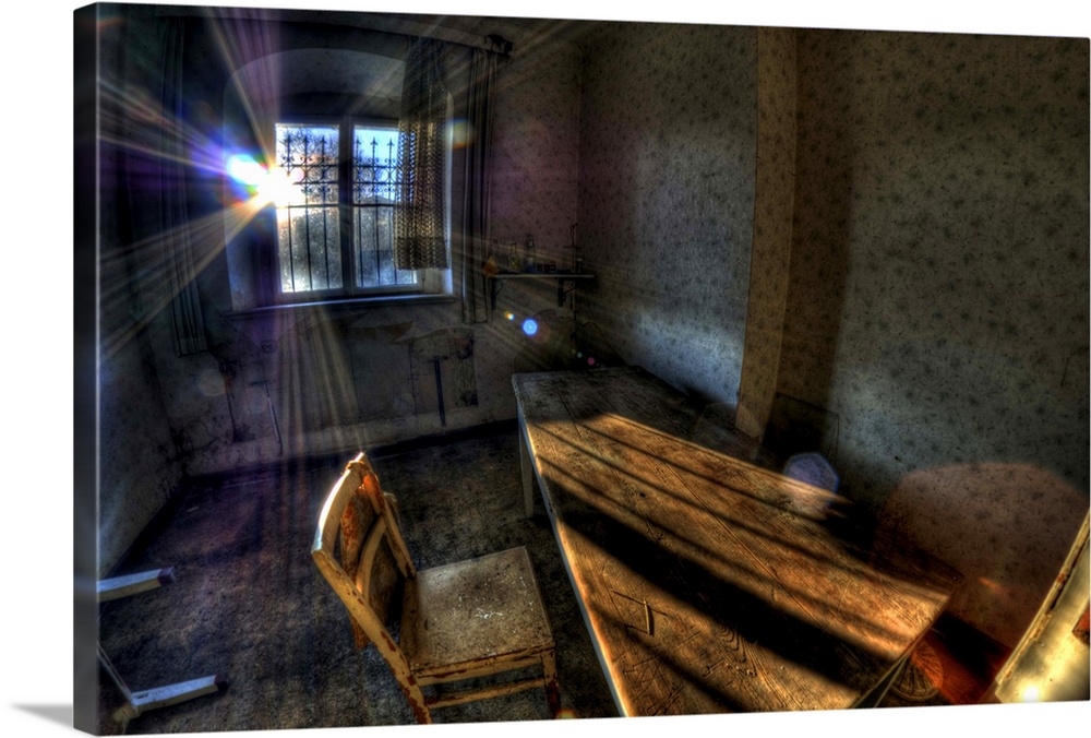 Abandoned room interior with chair and desk and sunlight from behind