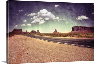 Large monolithic rocks in the background looking through Monument Valley V