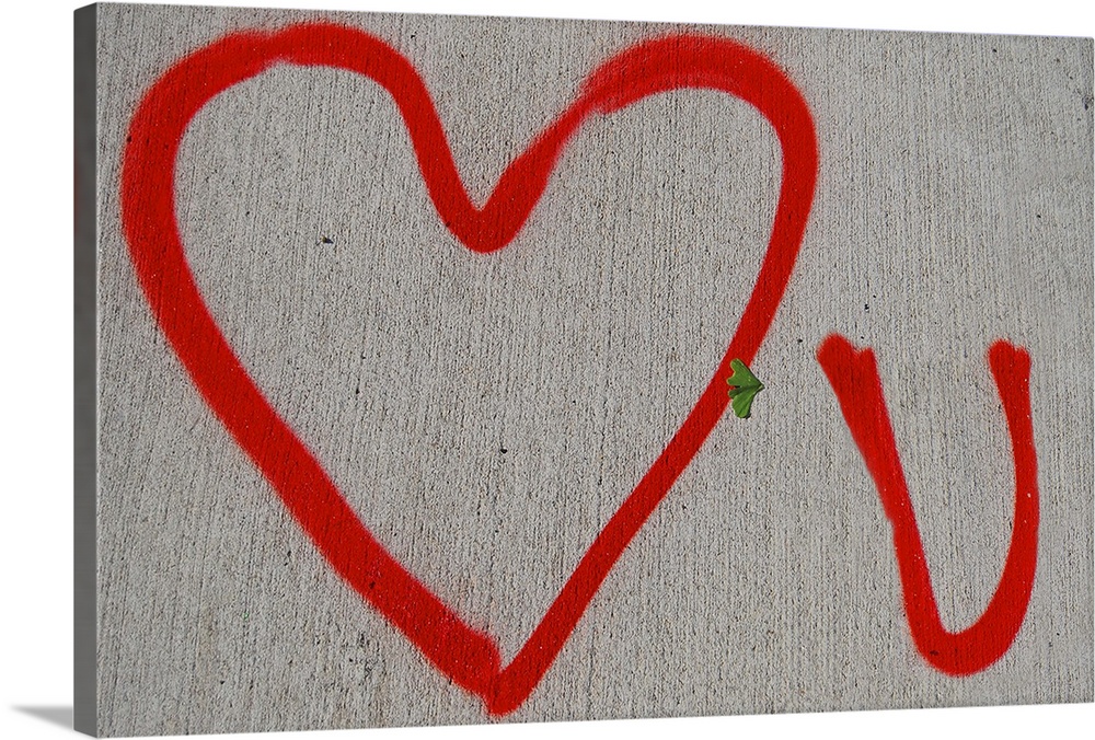 Red Love You graffiti on a New York City sidewalk.