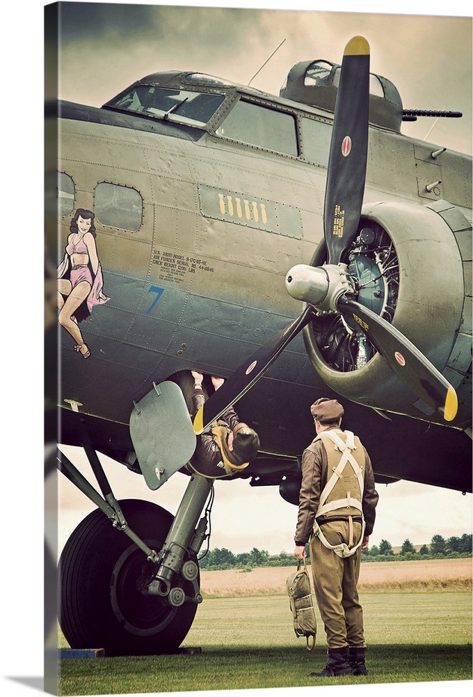 Pilots climbing onboard a B-17G Flying Fortress bomber.