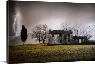 Ruined cottage in a stormy day and lightning in Castel Frentano, Italy