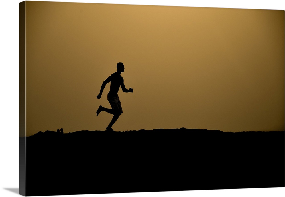 Barefoot man running.