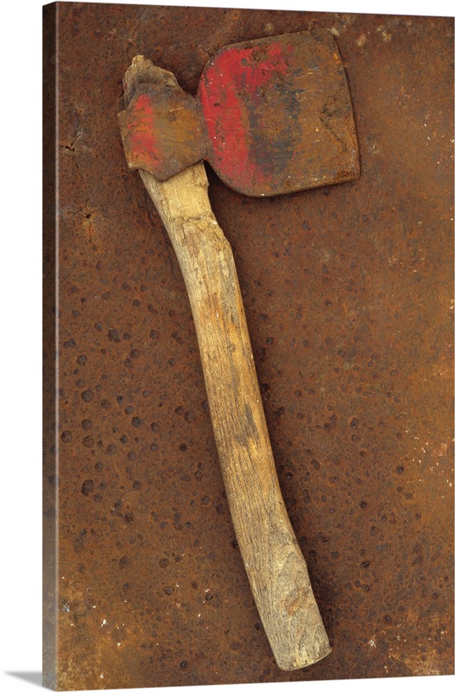 Rusty axe once red on makeshift wooden handle lying on rusty metal sheet