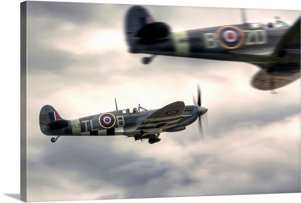 Two Spitfires scrambling to takeoff at Duxford.
