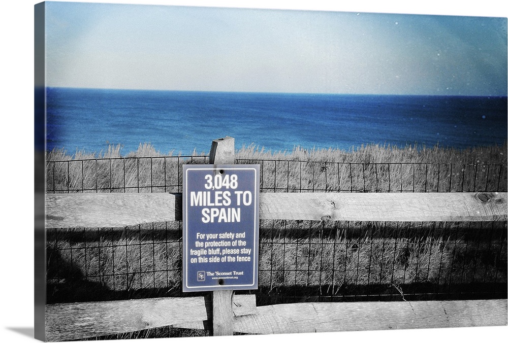 Sign on Nantucket Island, Massachusetts, giving the distance to Spain. 50s studio style with added textures.